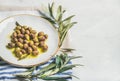 Pickled green Mediterranean olives and olive tree branch, copy space Royalty Free Stock Photo
