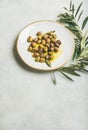 Pickled green Mediterranean olives in virgin olive oil, copy space Royalty Free Stock Photo