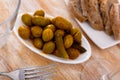 Pickled green olives with cucumber - typical Spanish tapas olivas verdes y pepinos