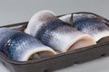 Pickled herring fillets on skin on foam food tray Royalty Free Stock Photo