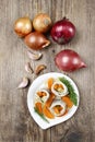 Pickled herring rolls with vegetables on wooden table Royalty Free Stock Photo