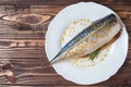 Pickled mackerel in a white plate. Raw unprepared fish. Traditional seafood delicacy, healthy eating concept Royalty Free Stock Photo