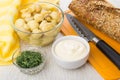 Pickled mushrooms, napkin, bowls with mayonnaise and dill, bread