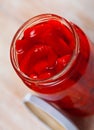 Pickled peppers in a glass jar on wooden table Royalty Free Stock Photo