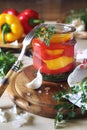 Salad of pickled bell pepper in jar and its ingredients