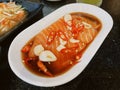 Pickled salmon, a popular food in Thai buffet restaurants.