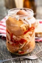 Pickled sausages with onion and red pepper. Marinated food