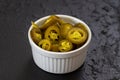 Pickled sliced green jalapeno peppers in white bowl. Close up Royalty Free Stock Photo