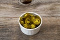 Pickled Sliced Green Jalapeno Peppers In White Bowl. Close Up