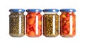 Pickled spices, capers, peppers, green peppercorns and piri piri, in glass jars