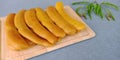 Pickled tamarind : preserved sweet tamarind fruit on gray background.