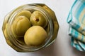 Pickled Unripe Green Almond Pickles in Glass Bottle Jar / Cagla Badem. Royalty Free Stock Photo