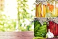 Pickled vegetables fermented process glass jars variety on table with copy space Royalty Free Stock Photo
