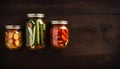 Pickled Vegetables in Jars on Wooden Background, Copy Space