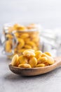 Pickled yellow Lupin Beans in wooden spoon Royalty Free Stock Photo