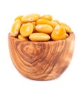 Pickled yellow lupine beans in olive bowl, isolated on white background. Tournus, preserved lupinus.