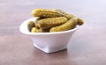 Pickles. Bowl of pickled gherkins cucumber with copy space. Cornichons. Royalty Free Stock Photo
