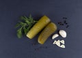 Pickles, dill, garlic, bell pepper on black stone background top