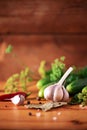 Pickling cucumbers in cans. Ingredients for marinated gherkins, glass jar, garlic, dill, salt, pepper on green Royalty Free Stock Photo