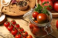 Pickling jar with ripe cherry tomatoes and spices on wooden table, closeup Royalty Free Stock Photo