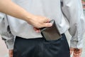 Pickpocket stealing a mans wallet from back pocket Royalty Free Stock Photo