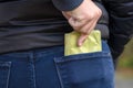 Pickpocket stealing a protruding purse