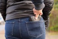 Pickpocket stealing a purse from a woman