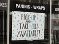 Pickup and takeout sign in restaurant window