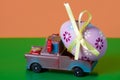 Pickup toy carrying one decorated easter egg Royalty Free Stock Photo