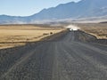 Pickup truck approaching on a gravel road