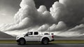 A pickup truck is driving down the road. Dark dramatic landscape as background, gloomy sky with rainy clouds, forest and hill. Royalty Free Stock Photo
