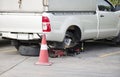 Pickup truck removes wheels to change wheels and tires by using a jack to lift Royalty Free Stock Photo