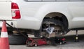 Pickup truck removes wheels to change wheels and tires by using a jack to lift Royalty Free Stock Photo