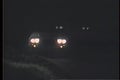 Pickup truck skidding off road at night