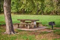 Picnic area with table and grill in the park