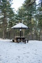 Picnic area with table in the woods in the snow Royalty Free Stock Photo