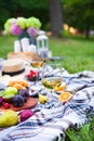 Picnic background with white wine and summer fruits on green grass, summertime party Royalty Free Stock Photo