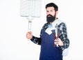 Picnic and barbecue. Cooking meat in park. Masculine hobby. Bearded hipster wear apron for barbecue. Roasting and Royalty Free Stock Photo