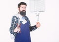 Picnic and barbecue. Cooking meat in park. Masculine hobby. Bearded hipster wear apron for barbecue. Roasting and Royalty Free Stock Photo