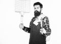 Picnic and barbecue. Cooking meat in park. Masculine hobby. Bearded hipster wear apron for barbecue. Roasting and Royalty Free Stock Photo