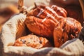 Picnic basket with bread, buns, rolls at the beach. Picnic outdoors