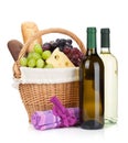 Picnic basket with bread, cheese, grape and wine bottles Royalty Free Stock Photo