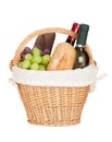 Picnic basket with bread, cheese, grape and wine bottles Royalty Free Stock Photo