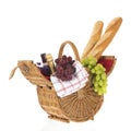 Picnic basket with bread wine and grapes Royalty Free Stock Photo