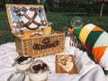 Picnic Basket Food On Blanket And Soap Bubbles