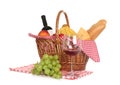 Picnic basket with food and glass of wine Royalty Free Stock Photo