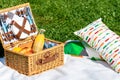 Picnic Basket Food On White Blanket With Pillows Royalty Free Stock Photo
