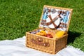 Picnic Basket Food On White Blanket Royalty Free Stock Photo