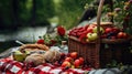 Picnic basket with fruit and bakery in garden. Royalty Free Stock Photo