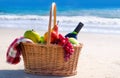 Picnic basket with fruits by the ocean Royalty Free Stock Photo